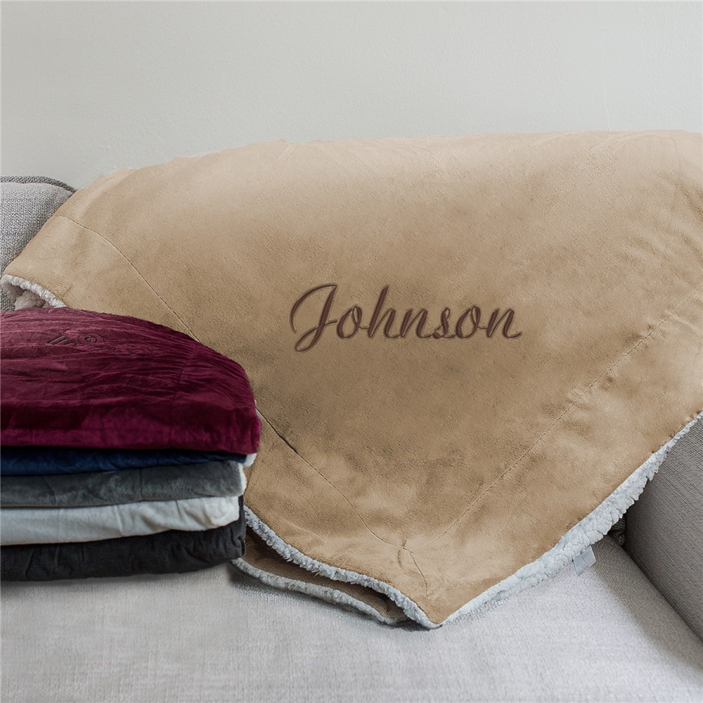 brown throw with one side being luxurious faux Micro Mink the other side cozy faux lambswool Sherpa with a personalised name on the front