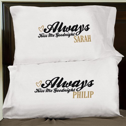 Pair of white pillow cases with gold and black embroidery